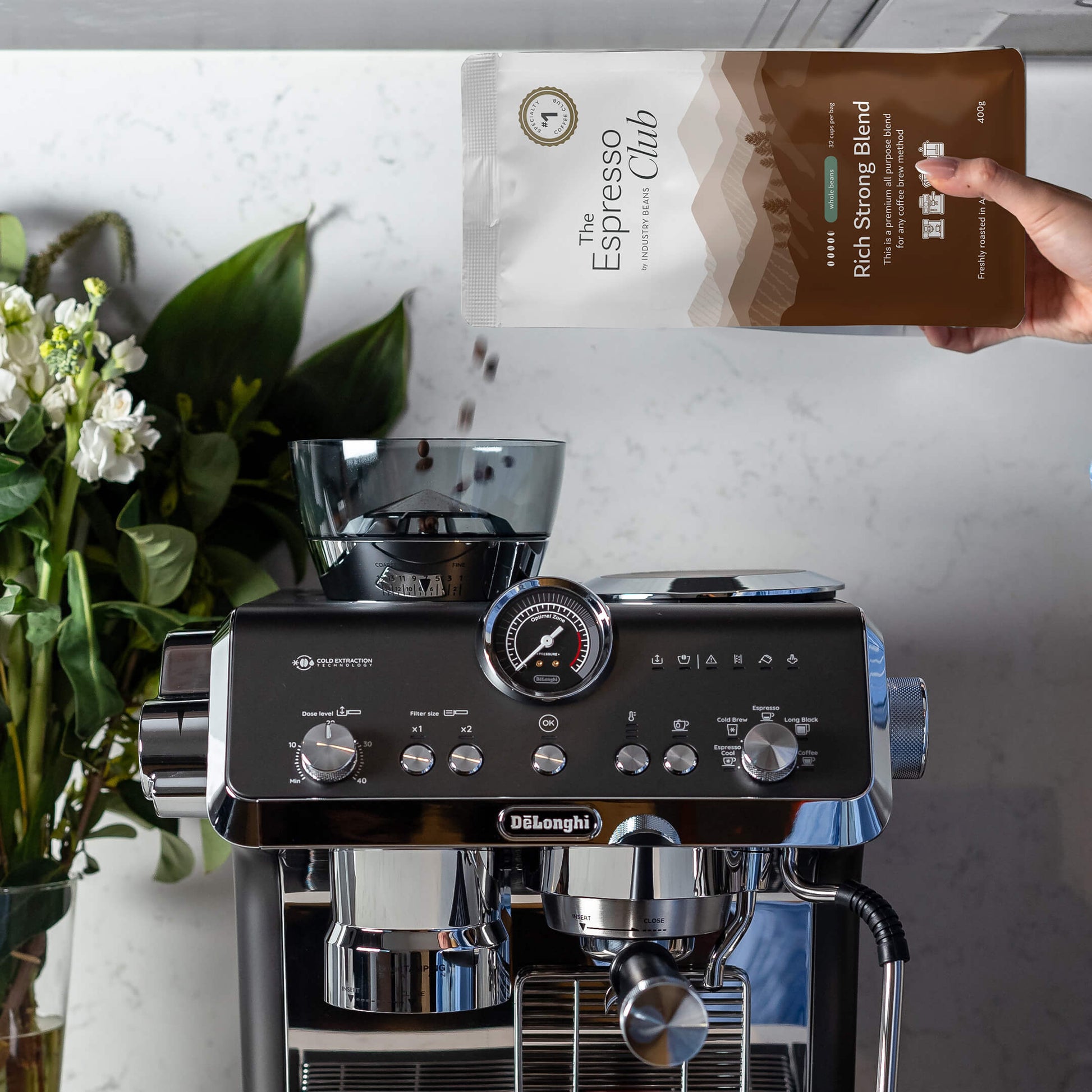Pouring Rich Strong Blend Whole Beans Into Coffee Machine